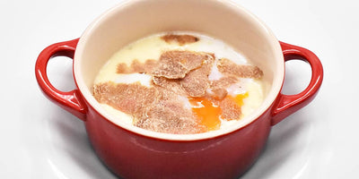 RECIPES - Slow-cooked egg with cheese fondue and white truffle.