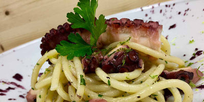RECIPES - Spaghetti di Gragnano I.G.P. with slow cooked octopus, red radicchio sauce, grilled octopus tentacle and lime zest